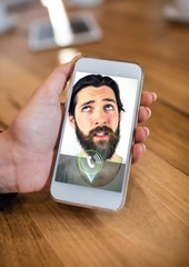 Poster - Hand of woman having video calling on mobile phone