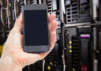Poster - Mans hand holding mobile phone in server room
