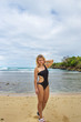 © Sergey - Young happy girl in black bikini  near the wild shore. Samana, Dominican Republic