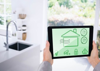 Poster - Hand holding digital tablet with home security icons on screen