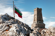 National memorial monument on Shipka peak, Bulgaria and waving Bulgarian flag