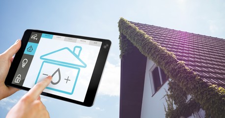 Poster - Hand holding digital tablet with home security icons on screen