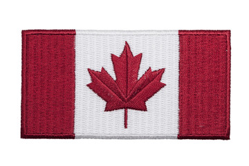 an embroidered canadian flag patch isolated on a white background.