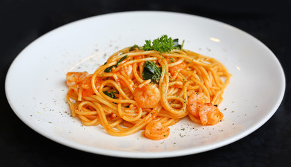 Spaghetti with shrimps and tomato sauce, italian cuisine