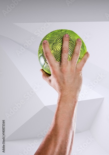 Plakat Sportowiec ręka trzyma piłkę ręczną