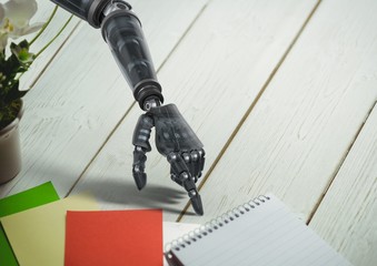 Poster - Robot hand pointing at spiral diary on wooden table