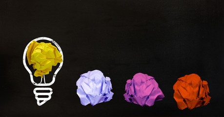 Wall Mural - Conceptual image of bulb with multi colored crumpled paper