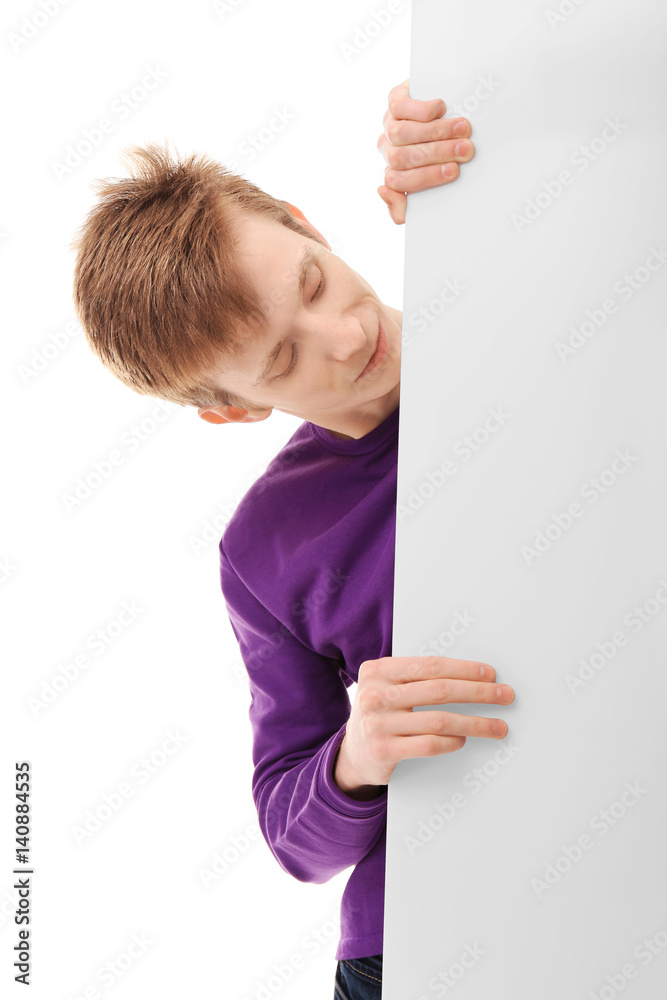 Teenager with poster on white background