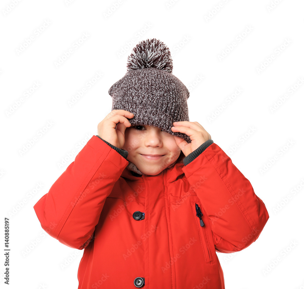 Cute little boy in warm clothes on white background