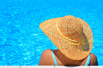 Real female beauty relaxing at swimming pool