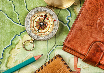 Wall Mural - compass wallet and passport on the old map