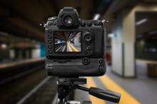 DSLR Camera On Tripod Performing A Long Exposure On A Subway Station
