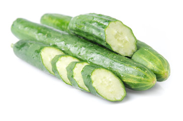 Wall Mural - Cucumber and slices isolated over white background.