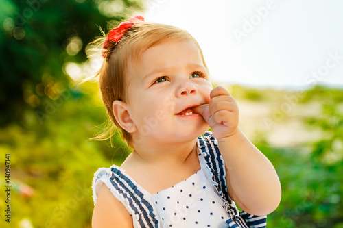 The Little Girl With Short Hair Suck Finger The Baby Is