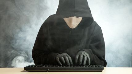 A hacker in his illegal work