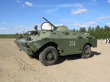 Russian Amphibious Armoured Patrol Car Combat Reconnaissance Or Patrol Vehicle BRDM-2 On The Ground In Combat Conditions