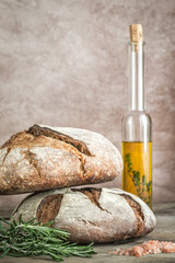 Canvas Print - Loaves of bread with olive oil and fresh rosemary