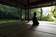 © Raymond Patrick - Person meditating in temple, Kyoto, Japan