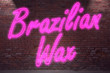 © pixs:sell - Leuchtreklame Brazilian Wax an Ziegelsteinmauer