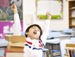 asian primary school student stretching in classroom