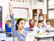 © imtmphoto - asian pupil raising hands in classroom