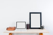 © longkaud - Mockup frame photo on wooden table, Frame on white wooden table, put walls white background, Business Accessories on wooden table