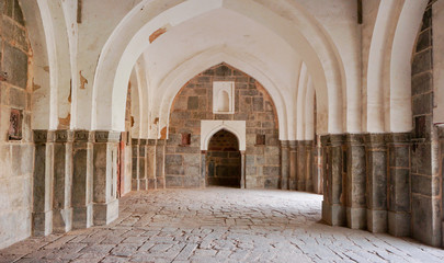 Archways of ancient stone church