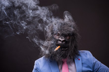 Businessman Wearing Gorilla Mask And Smoking Cigar