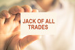 © stanciuc - Businessman holding JACK OF ALL TRADES message card