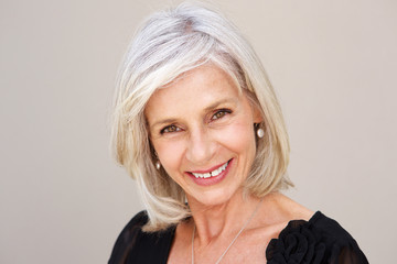 smiling older woman looking happy in black blouse