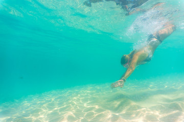 Wall Mural - Woman in bikini at swimming pool