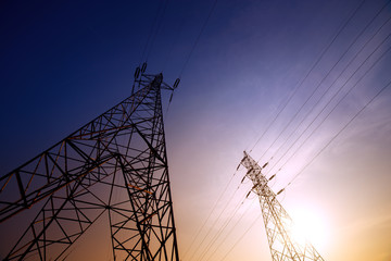 Wall Mural - high voltage post or high voltage tower at sunset