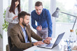 © LStockStudio - Businessmen and businesswoman working in office