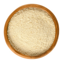 Nutritional Yeast Flakes In Wooden Bowl, Made From Deactivated Dried Yeast. Food Product, Used As An Ingredient In Recipes Or As An Condiment. Isolated Macro Food Photo Close Up From Above Over White.