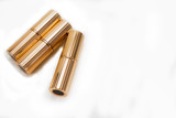 Fototapeta Na sufit - Luxury lipsticks in golden package.