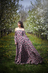 beautiful woman in dress in the gardens