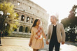 Loving couple in front of the Colosseum in Rome, Italy