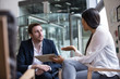 © ReeldealHD images - Business meeting in office atrium reception