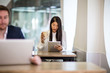 © ReeldealHD images - Businesswoman in a café reading a digital tablet