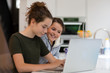 © ReeldealHD images - Sisters using laptop together