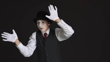 The Mime Is Behind An Invisible Wall. Black Background
