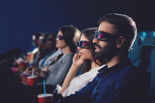 Side View Of Couple In 3d Glasses Watching Movie.
