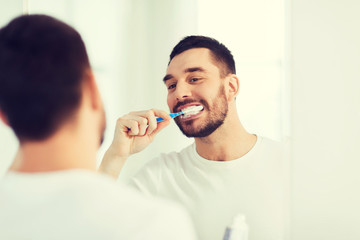 Poster - man with toothbrush cleaning teeth at bathroom