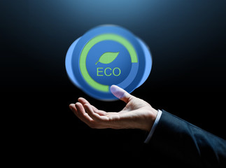 Sticker - close up of businessman hand with eco icon