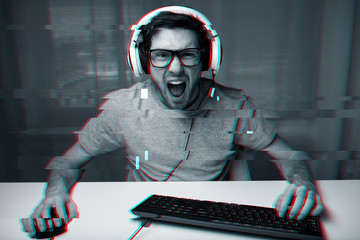 Poster - man in headset playing computer video game at home