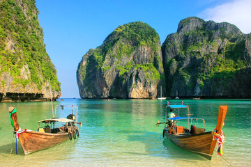 Longtail boats anchored at Maya Bay on Phi Phi Leh Island, Krabi Province, Thailand