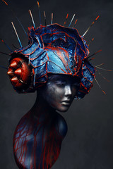 Mannequin in creative head wear with spikes