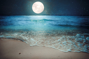 beautiful fantasy tropical beach with star and full moon in night skies - imagine style artwork with