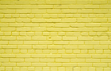 Old Brick Brick Wall Painted With Yellow Paint For Textures Or Backgrounds