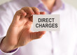 © stanciuc - Businessman holding a card with DIRECT CHARGES message